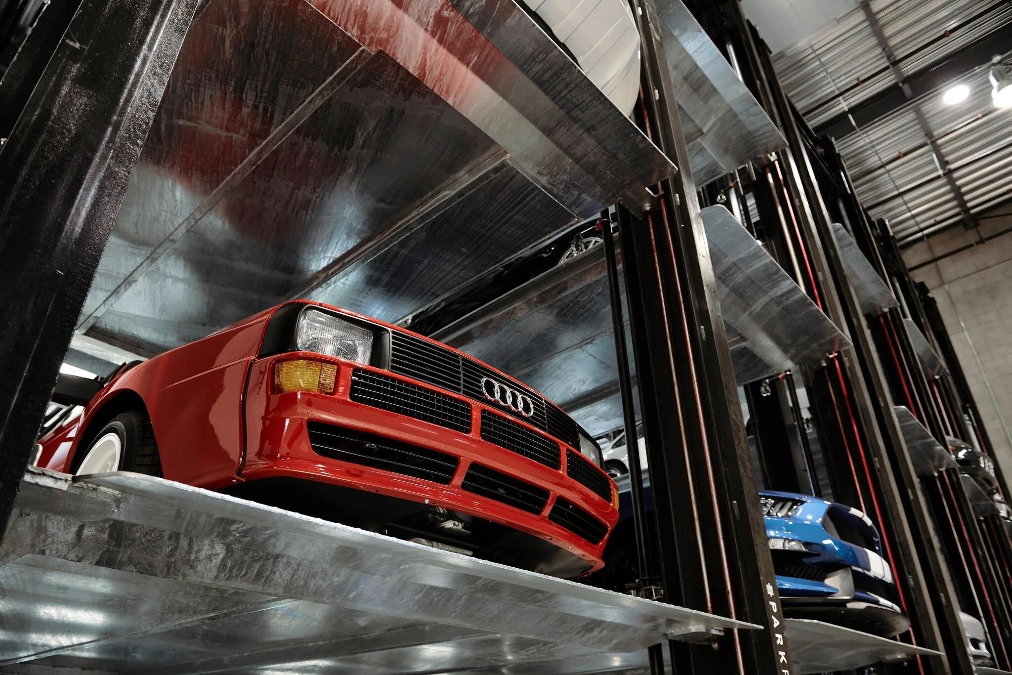 Red Audi on a ParkPlus QP1000 Quad Stacker platform at Westside Collector Car Storage