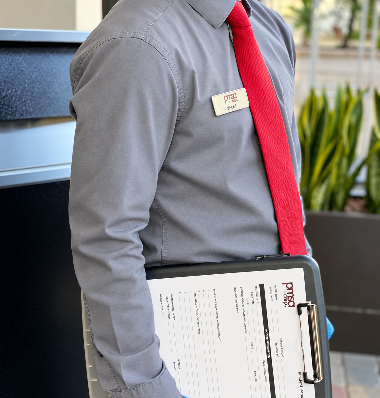 PMSA uniformed valet attendant with incident report clipboard